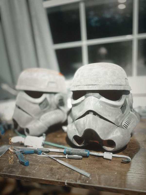 A 3D printed helmet being prepared and sanded